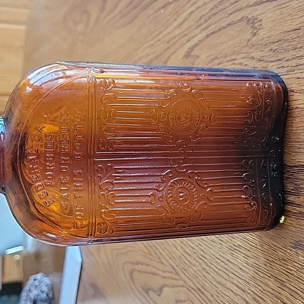 Hiram Walker's limited vintage, one pint, bottle amber color with trade mark.